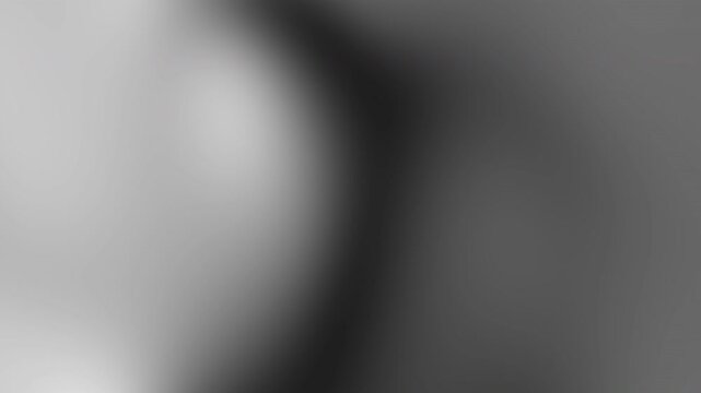 Soft grayscale image featuring a bright left flare and smooth, blurred transitions across the frame