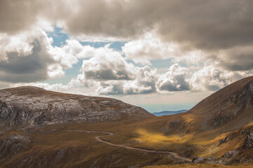 Fototapeta premium The Transalpina or DN67C is a 148 km national road located in the Parâng Mountains group, Southern Carpathians of Romania, one of the highest roads of the Carpathian Mountains