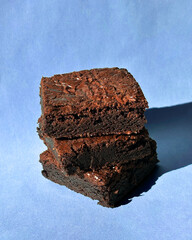 Fudgy Chocolate Brownies on Colorful Background &ndash; Sweet Dessert Food Photography