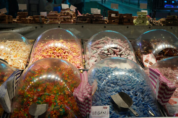 Assorted colorful pick and mix sweets and candies at a traditional fairground stall during Goose Fair in Nottingham, England.