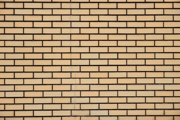 茶色い外壁タイルのテクスチャ。四角い模様の背景