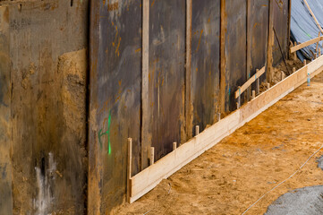 Construction site retaining wall excavation shoring ground preparation