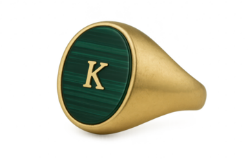 Gold signet ring, initial K on green, isolated subject on transparent.
