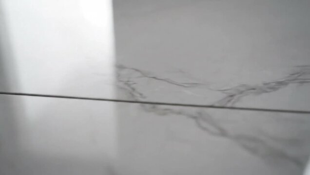 Polished grey marble surface with subtle veining pattern  