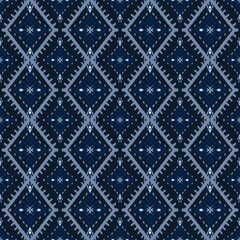 Dark blue tribal ikat seamless fabric pattern with cultural geometric diamond ethnic textile ornament background design