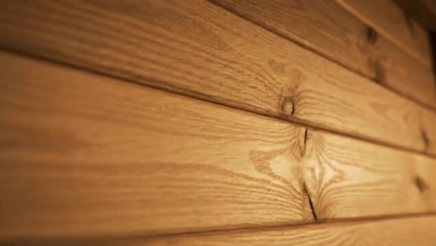 Wooden wall paneling with natural texture in warm tones  
