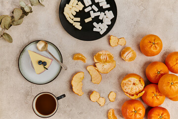 A festive display of fresh oranges, sweet treats, and warm coffee awaits for the holiday season.