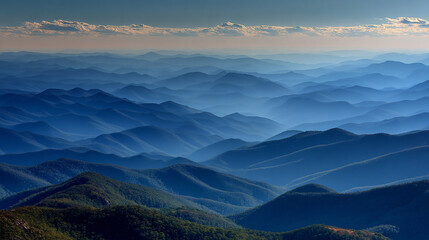 Obraz premium Misty blue mountains layered under a soft sky, symbolizing tranquility, depth, serenity, natural beauty, and peaceful landscapes in a dreamy atmospheric setting.