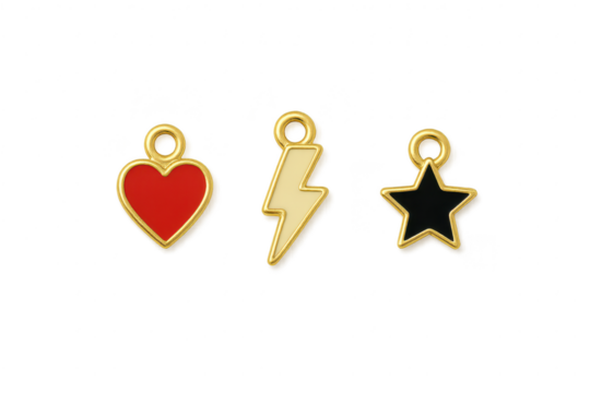 Three gold plated pendants heart, lightning bolt and star on transparent background