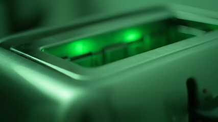 Mysterious Toaster with Eerie Green Light Pops Up in Sci-Fi Kitchen Appliance Close-Up - Powered by Adobe