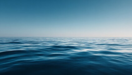 Fototapeta premium Vast ocean expanse under a clear blue sky, tranquil waves gently rolling across the horizon creating a sense of peace and freedom