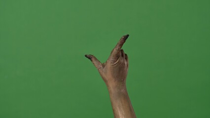 A creepy zombie hand zooms in on a virtual screen