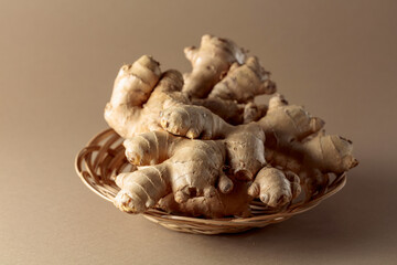 Ginger root on a beige background.