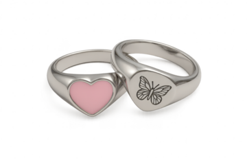 Silver rings with heart and butterfly, isolated on a clear background