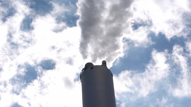 Copenhagen Amager Bakke Copenhill, is a combined heat and power waste-to-energy plant, detail of chimney of power plant while smoking steam