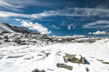 Winter sky with clouds in the Central Alps, Valmalenco, Italy landscape