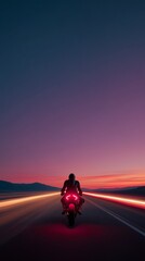 Obraz premium Lone motorcyclist speeds along highway, with glowing tail lights against a dramatic sunset, creating a sense of freedom and adventure.