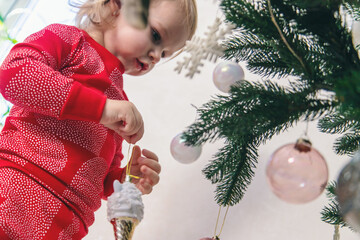 Little Girl Decorating the Christmas Tree