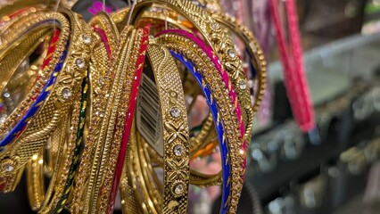 elaborate golden jewelry, intricate patterns, vibrant colors, opulent ornaments, detailed metalwork, eye-catching accessories, rich textures, luxurious embellishments, ornate design, opulent display
