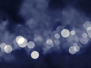 Dreamy abstract blue bokeh background with glowing white light circles design