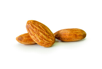Brown almond nuts in stack isolated on white background with clipping path