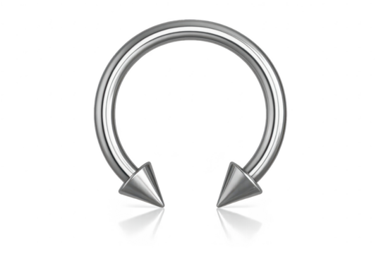 Isolated silver horseshoe body piercing with spiked ends on transparent