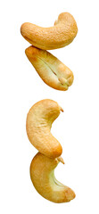 A set of four roasted or baked cashew nuts in two heaps isolated with clipping path in png file format