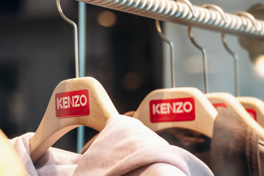 Paris, France - September 6, 2025: Kenzo Paris branded wooden hangers with clothing inside boutique at Place de la Madeleine