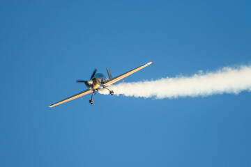 Stunt aerobatic plane performing stunts in air