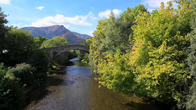 France, Pyrenees-Atlantiques, Basque Country, Saint-Etienne de Baigorry, Roman bridge spanning the Nive River. High quality 4k footage