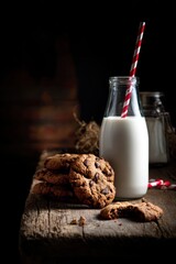 cookies and milk, dark background, food photography