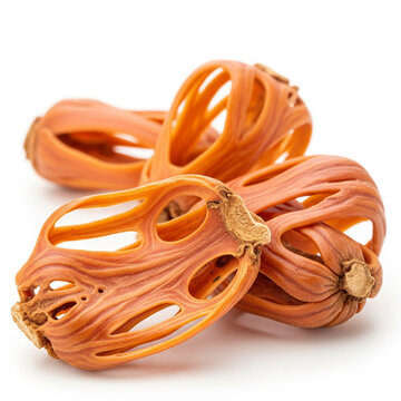 Close-up of dry whole mace spice (javitri) isolated on a white background.