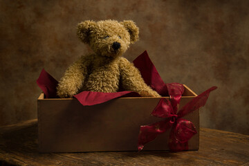 Adorable teddy bear in gift box