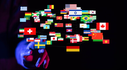 A hand reaching out to connect flags of different countries, symbolizing global unity, cooperation,...