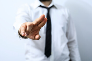 Fototapeta premium High-quality image of a businessman's hand reaching out, symbolizing opportunity, connection, and growth.