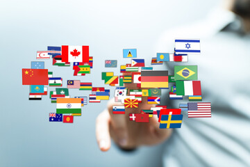 A hand pointing at various flags symbolizing global connection, diversity, and international...