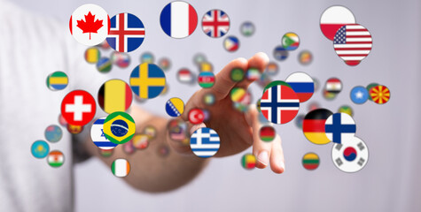A person's hand reaching towards various country flags, symbolizing global interconnectedness, travel, and international cooperation. Ideal for