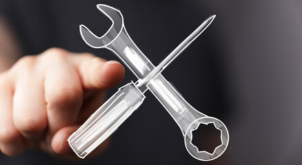 High-quality image of a hand pointing at a drawn wrench and screwdriver, perfect for repair, maintenance, and service concepts.