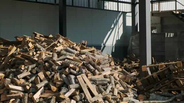 Stacking Firewood. Pile of firewood loggs. Preparation for winter heating season. Firewood background