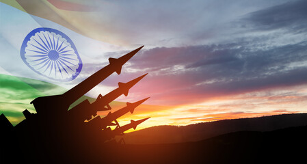 The missiles are aimed at the sky at sunset with Indian flag. Nuclear bomb, chemical weapons, missile defense, a system of salvo fire.