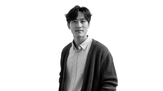 A portrait of Thoughtful Individual: A monochrome portrait captures a contemplative figure, dressed in a cardigan and shirt, set against an uncluttered background, evoking a sense of introspection.