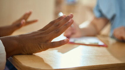Teenage girl expressing feelings with hands during child therapy session. Concept of psychology,...