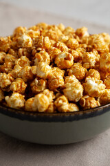 Homemade Caramel Pop Corn in a Bowl, low angle view. Close-up.