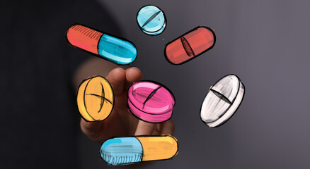 Hand interacting with colorful pills and capsules.  Perfect for healthcare, medicine, pharmacy, or health concepts.