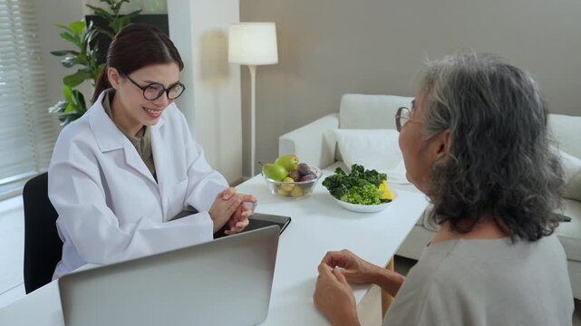 Food consultant  guides elderly client with balanced nutrition plan during calm, warm advice supports healthy meal choices and gentle lifestyle change.