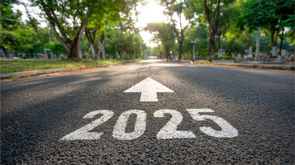 Hopeful concept of road to future success for new year. An arrow points forward giving direction toward goal on an asphalt path