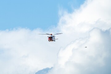 Hill Head England -February 22 2022: coastguard Helicopter airborne with blue sky in the background