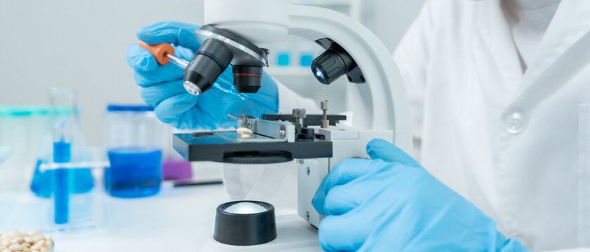 Scientist check chemical food residues in laboratory. Control experts inspect quality of fruits, vegetables. lab, hazards, ROHs, find prohibited substances, contaminate, Microscope, Microbiologist