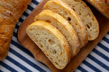 Homemade Cheese Ciabatta Bread on a Wooden Board, top view.