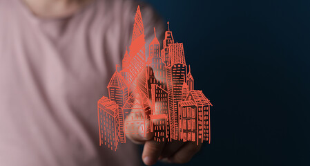 Hand pointing at a digital sketch of a city, symbolizing urban planning, development, and real...